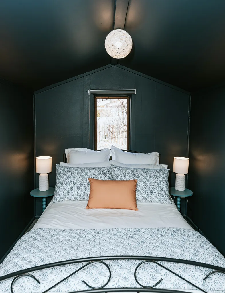 Resene Cinder was the choice for one bedroom in the winning Resene Colour Home Awards home, with the side tables painted in Resene Balderdash