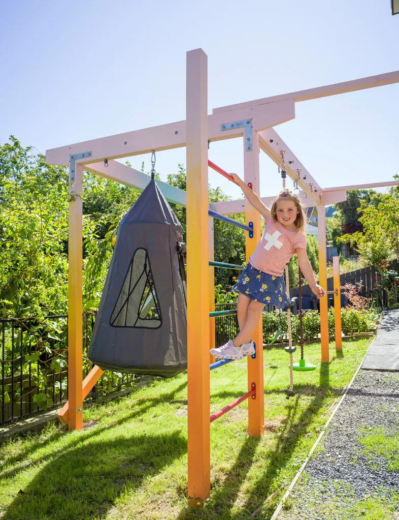 Addie enjoying her sunset coloured playground