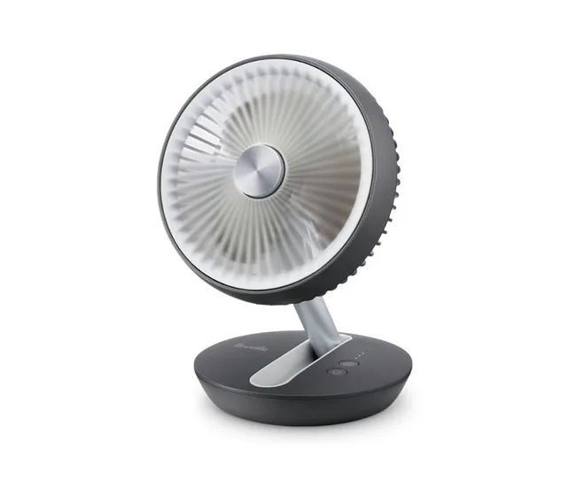 Grey tabletop portable fan against a white background