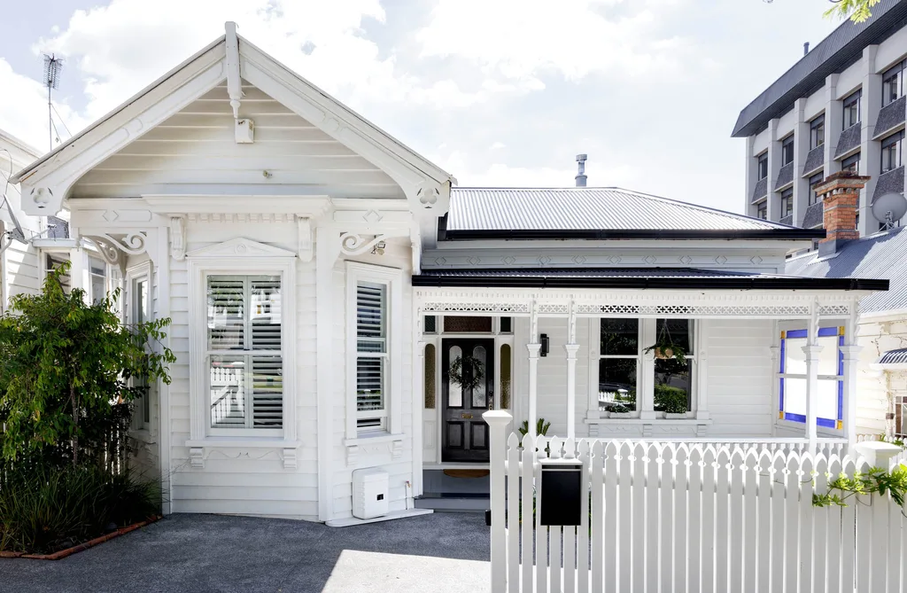 The street view of a white villa.