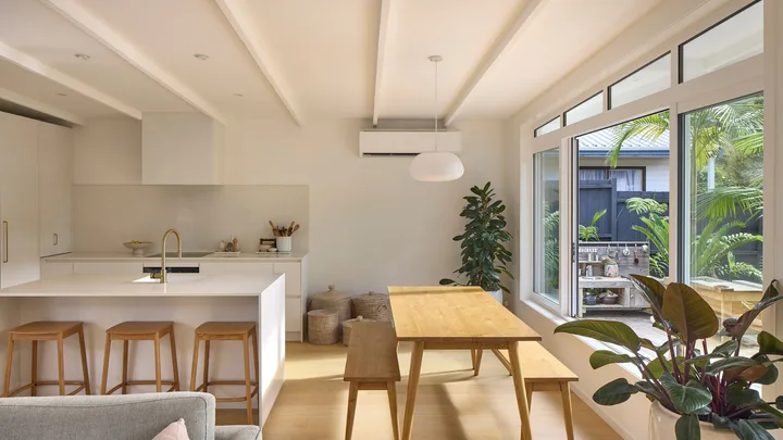 Kitchen and dining area in this mid century Titirangi home