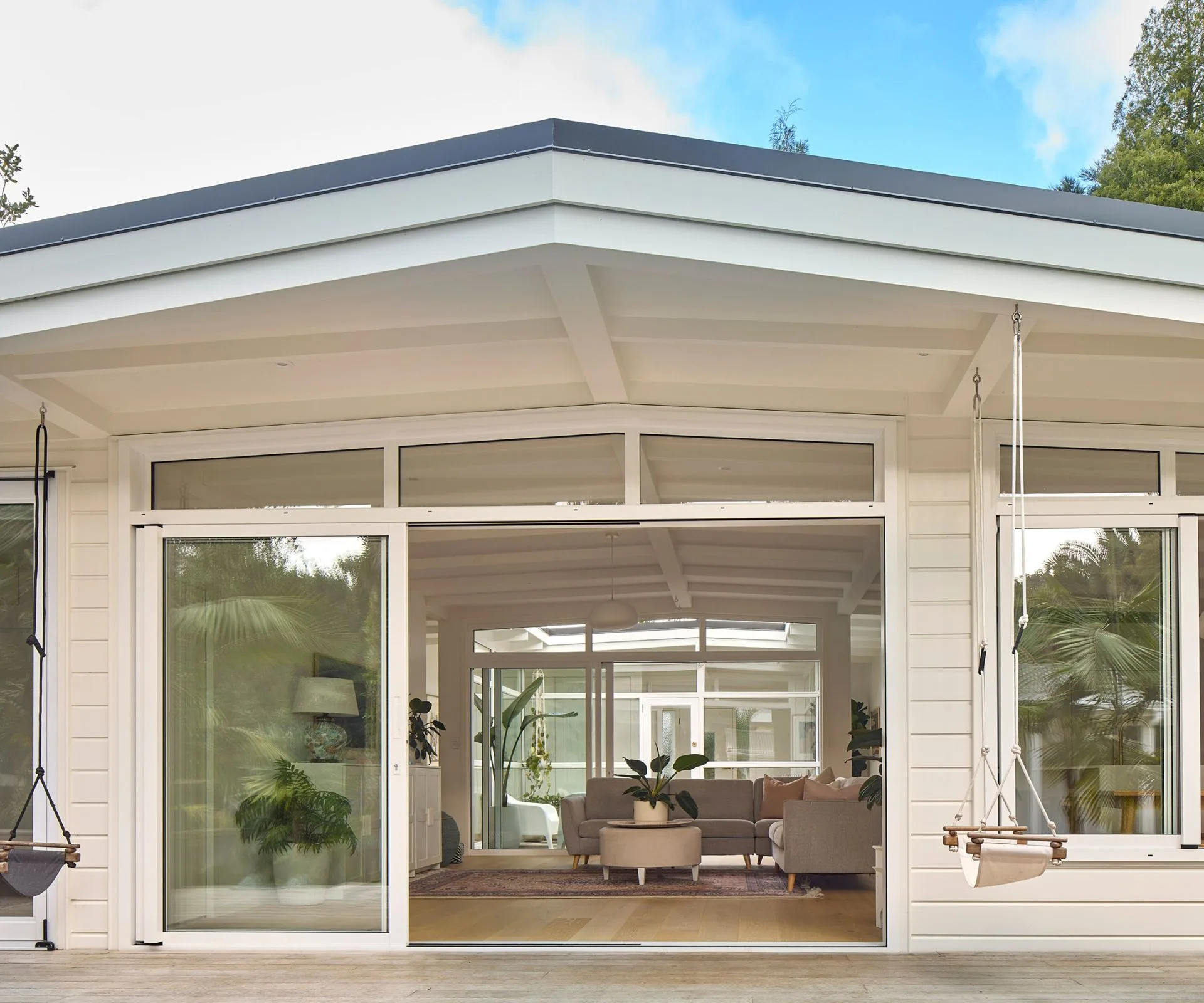 Sliding doors give easy indoor-outdoor flow in this Titirangi house