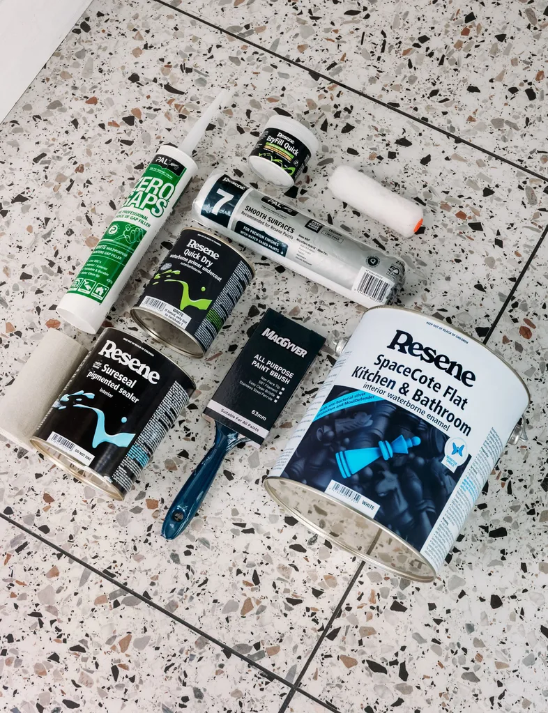 Flat lay of items needed to colour drench: sandpaper, Resene EzyFill Quick, PAL Zero gaps, brushes, Resene Quick Dry undercoat, Resene paint, microfibre rags, sealer