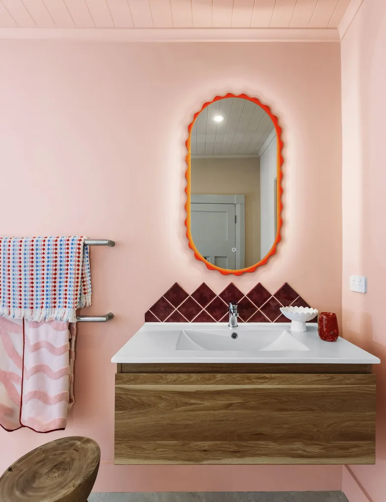 Reveal of colour drench project, this bathroom's walls and ceilings are painted in Resene Just Right, a brown-toned pastel pink