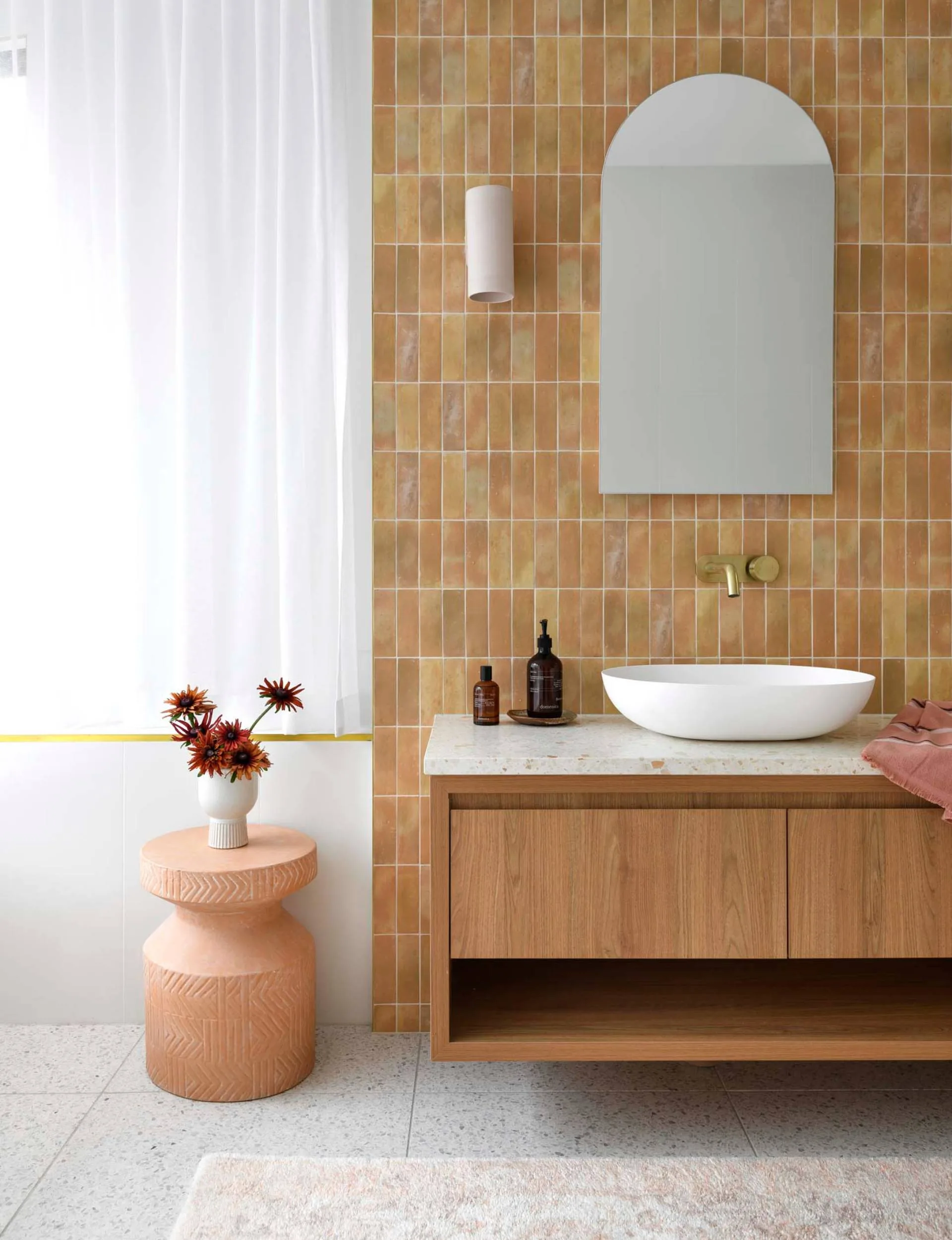 Orange tiles in a bathroom with white accents
