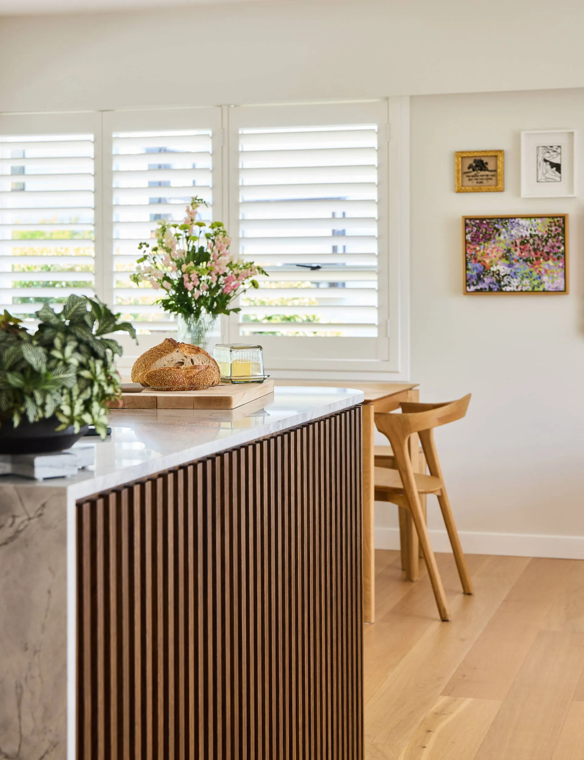 A loaf of fresh bread on the 70s home kitchen bench
