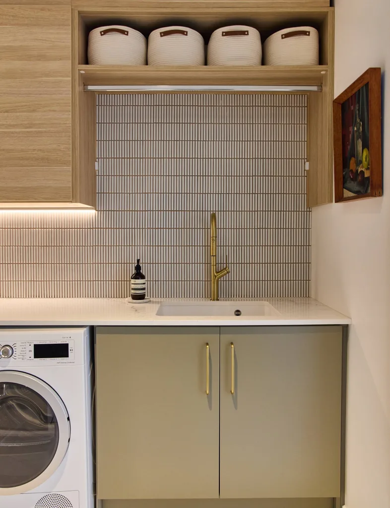 The wooden, white and olive laundry room