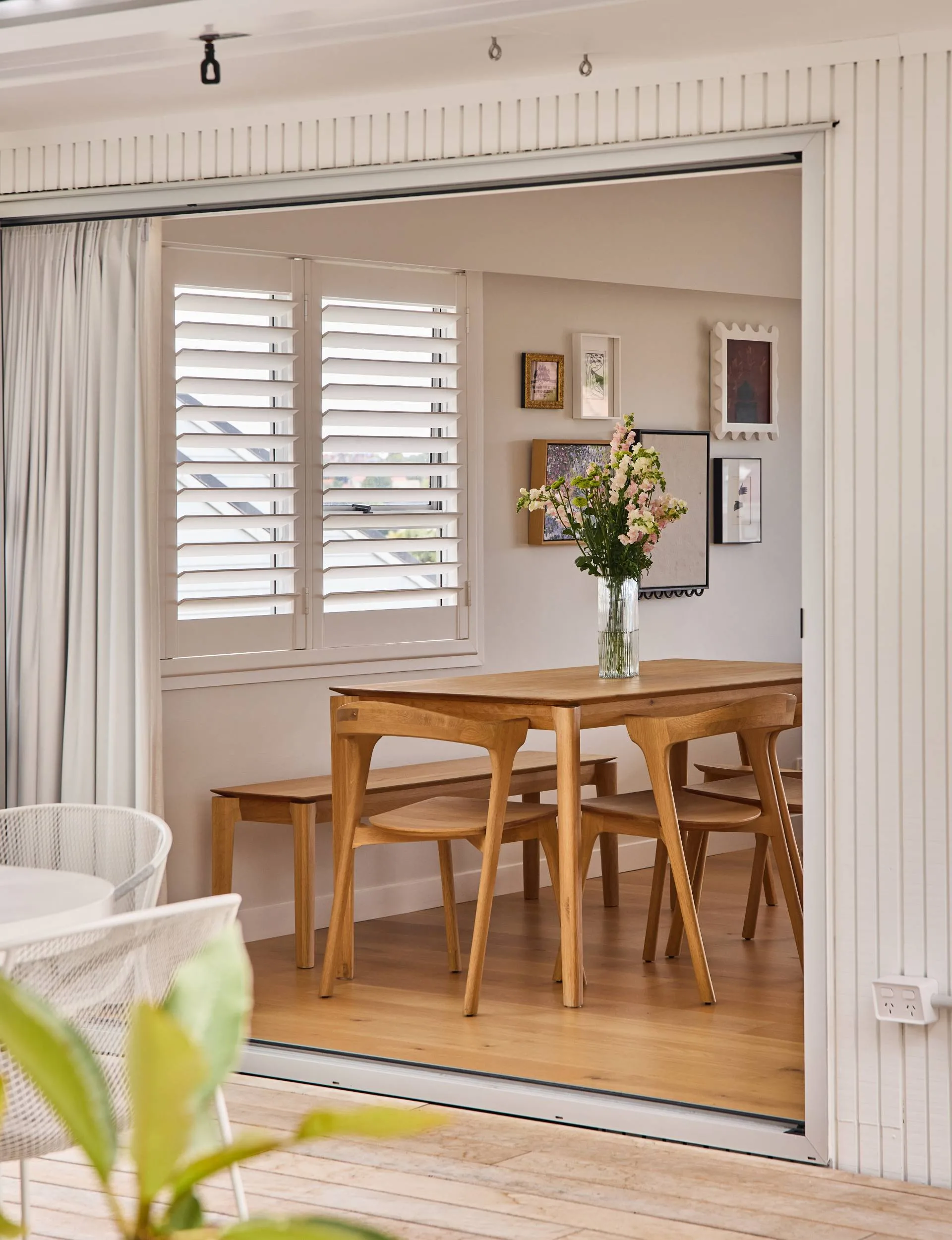 The 70s home dining room table and chairs viewed from outside looking in