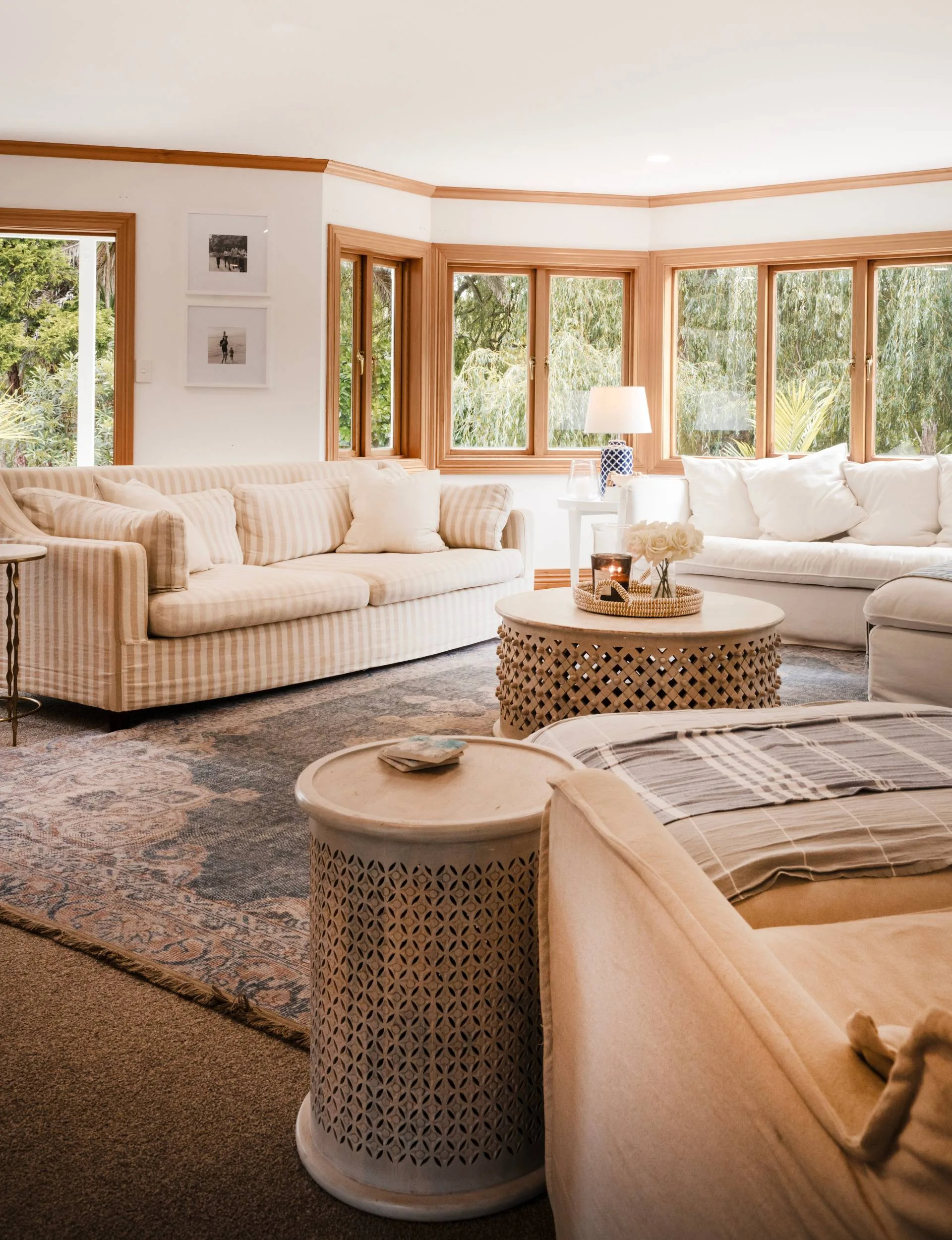 The Auckland homestead living room with white and beige vertical striped couches