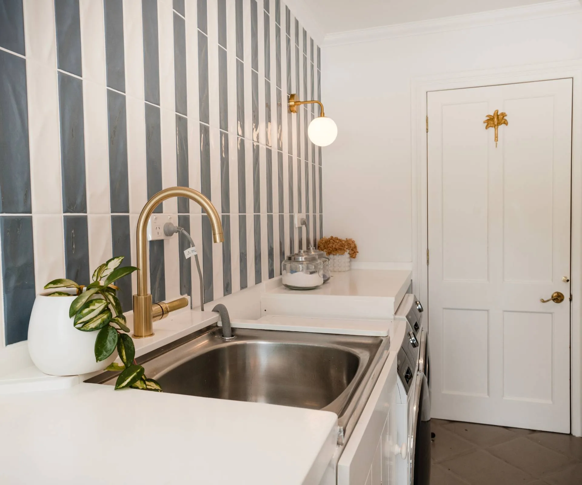 A blue and white tiled laudry