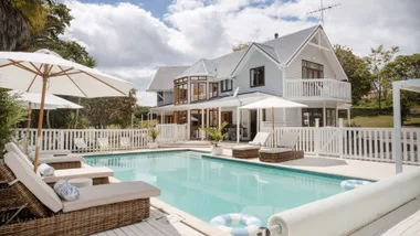 The exterior of the Auckland Homestead viewed from poolside