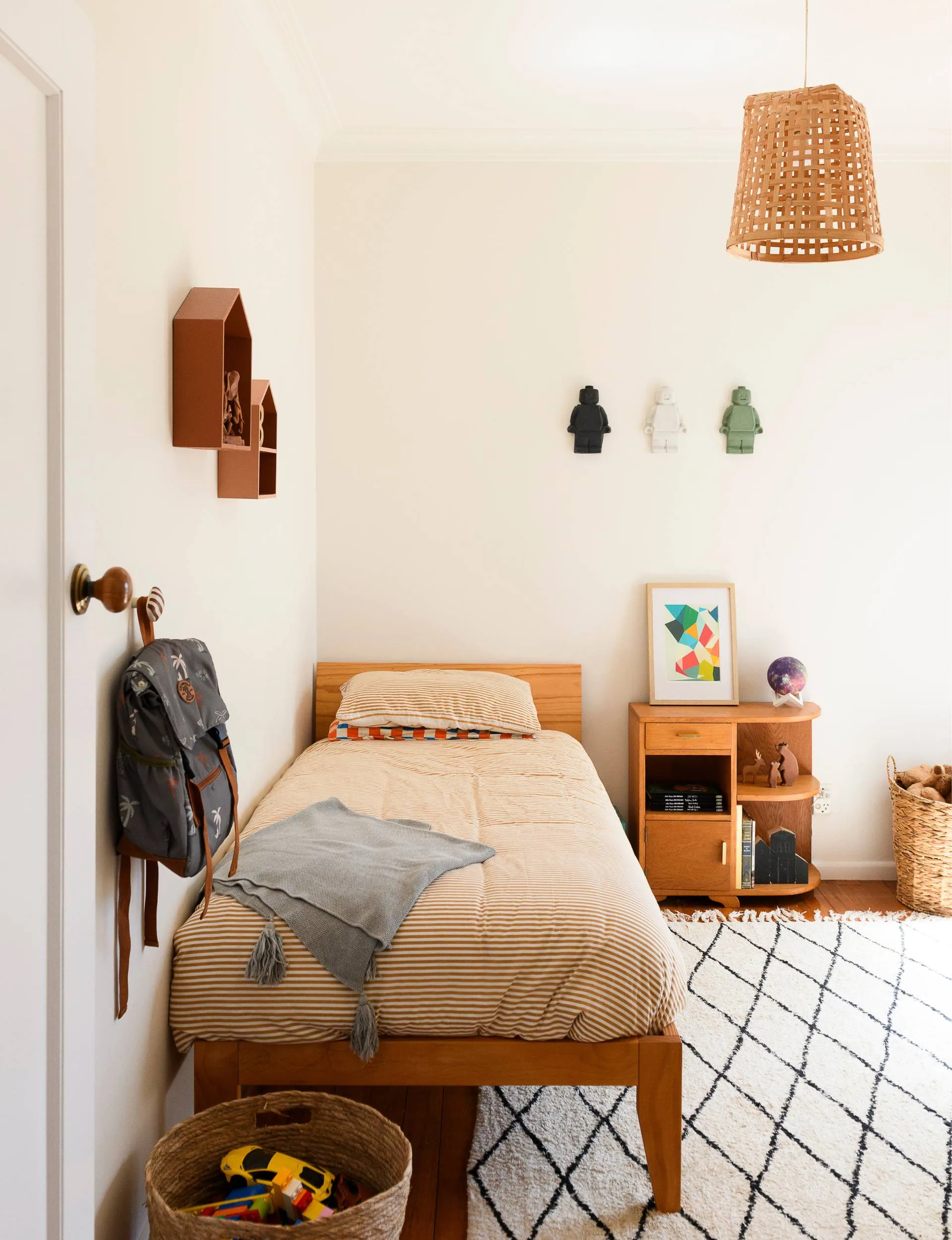 The Epsom art deco&nbsp;home kids' bedroom with little Lego figures on the wall and house-shaped storage shelving