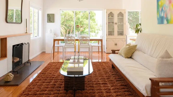 The living room of a 90's art deco home in Epsom