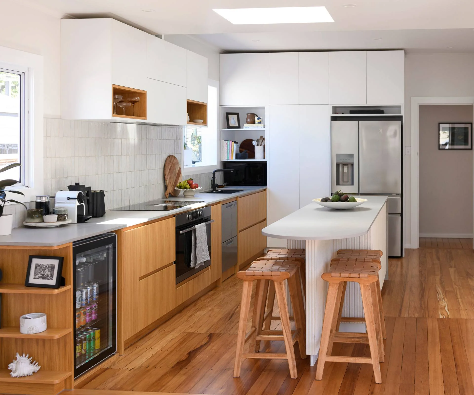 The white and wooden kitchen of the Epsom art deco&nbsp;home