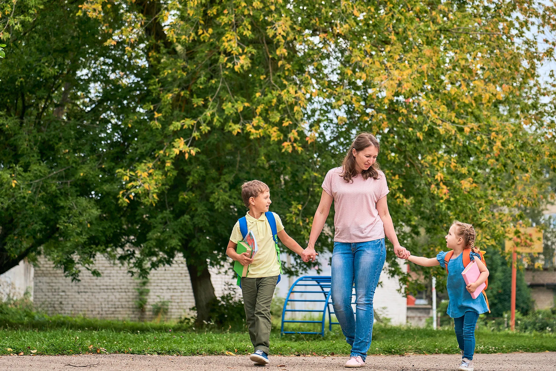 Mum with kids walking in park