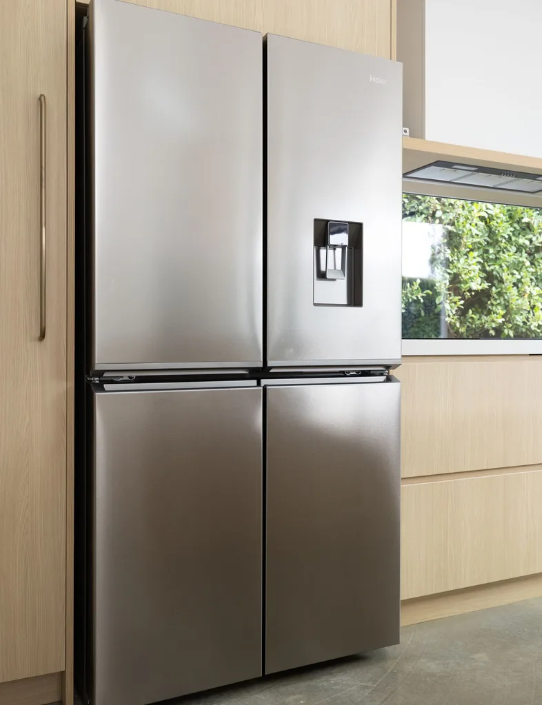 The Haier 600 Series Quad Door Refrigerator stores all the essentials for Skye Ross' family