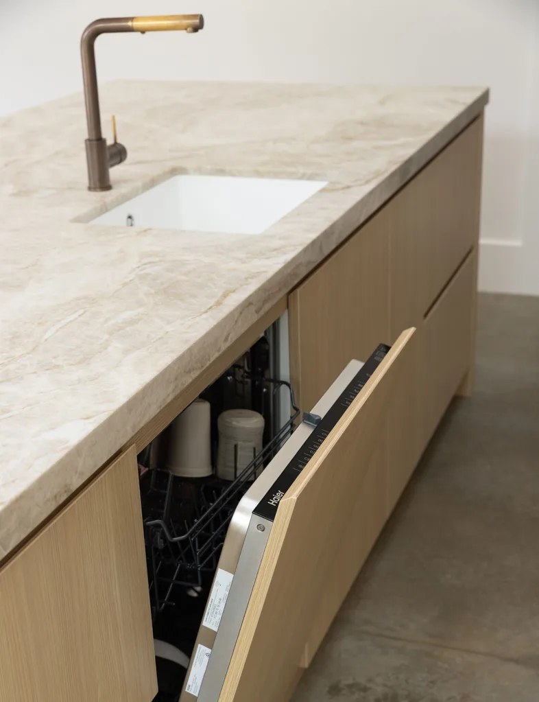 The Haier Integrated Dishwasher cleverly hides in the cabinetry