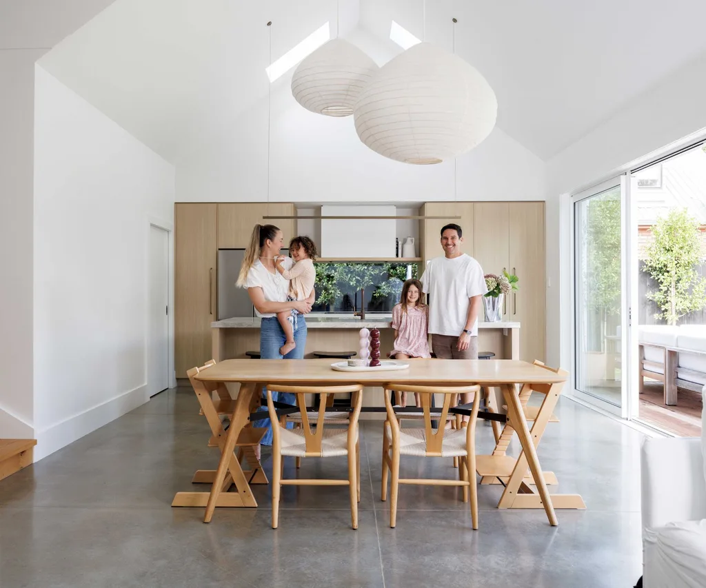 Homeowners Skye Ross and Mark Banbrook with their two kids in their open-spaced kitchen and dining