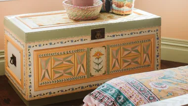 Green and sunset coloured blanket chest