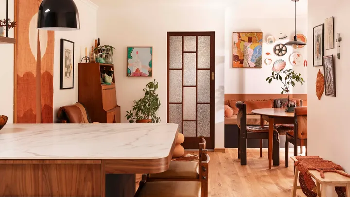A living room with various wall art.