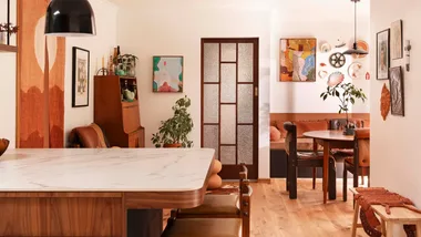 A living room with various wall art.