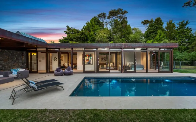 A mid century home with a pool