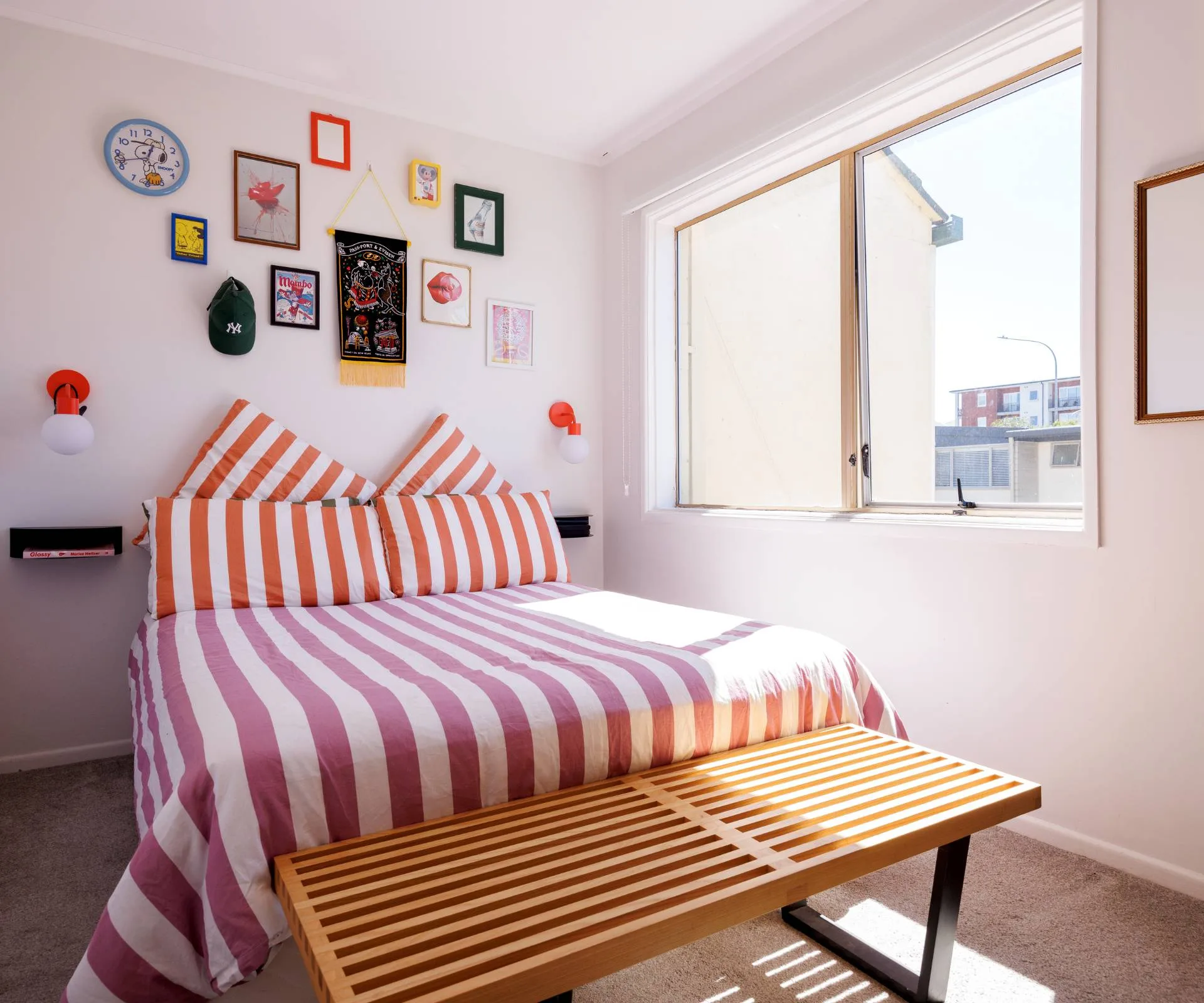 Pink and white striped bedding in the 1970s townhouse master bedroom