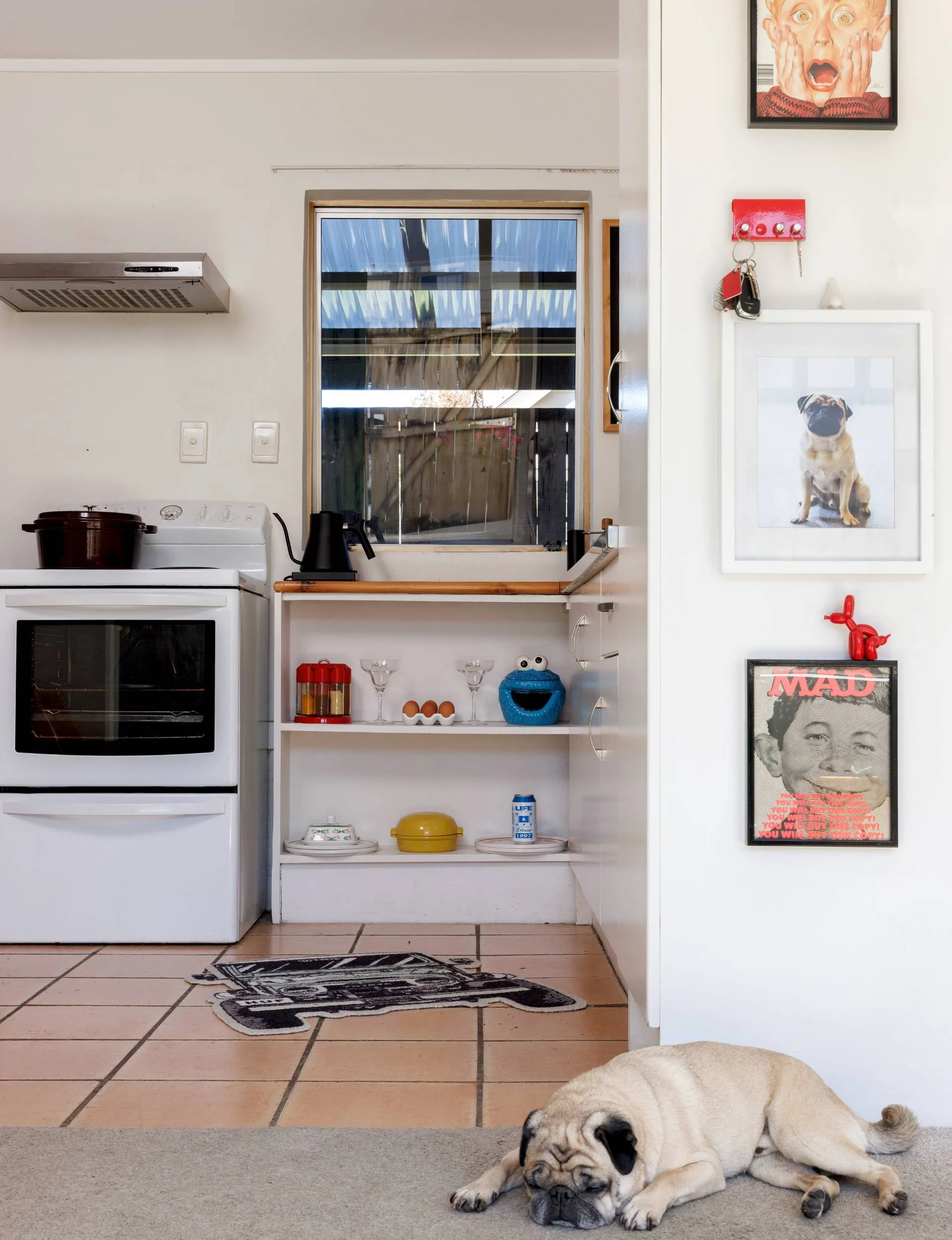 The kitchen viewed from the front entryway of the 1970s townhouse