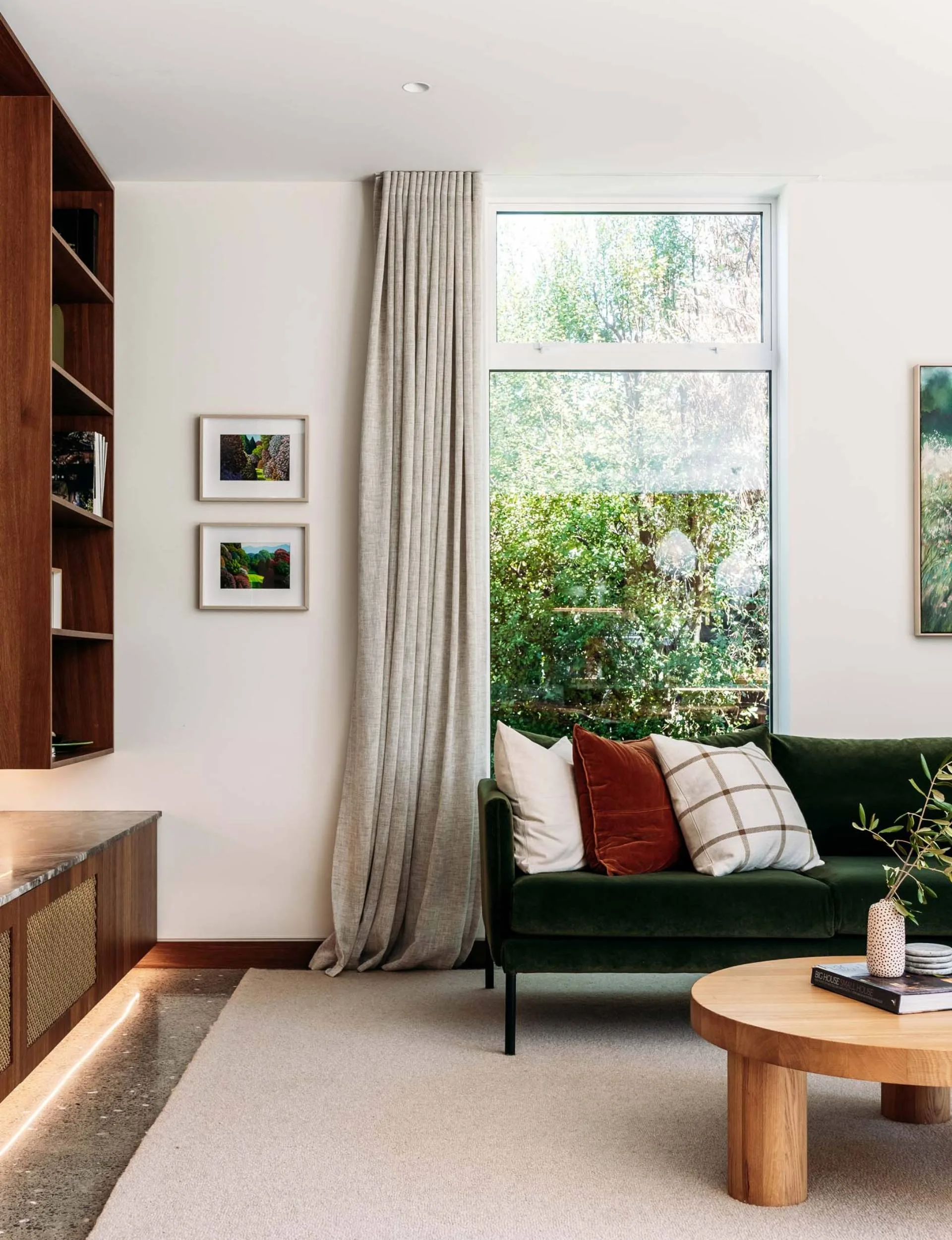 A green velvet couch in the Wellington home living room