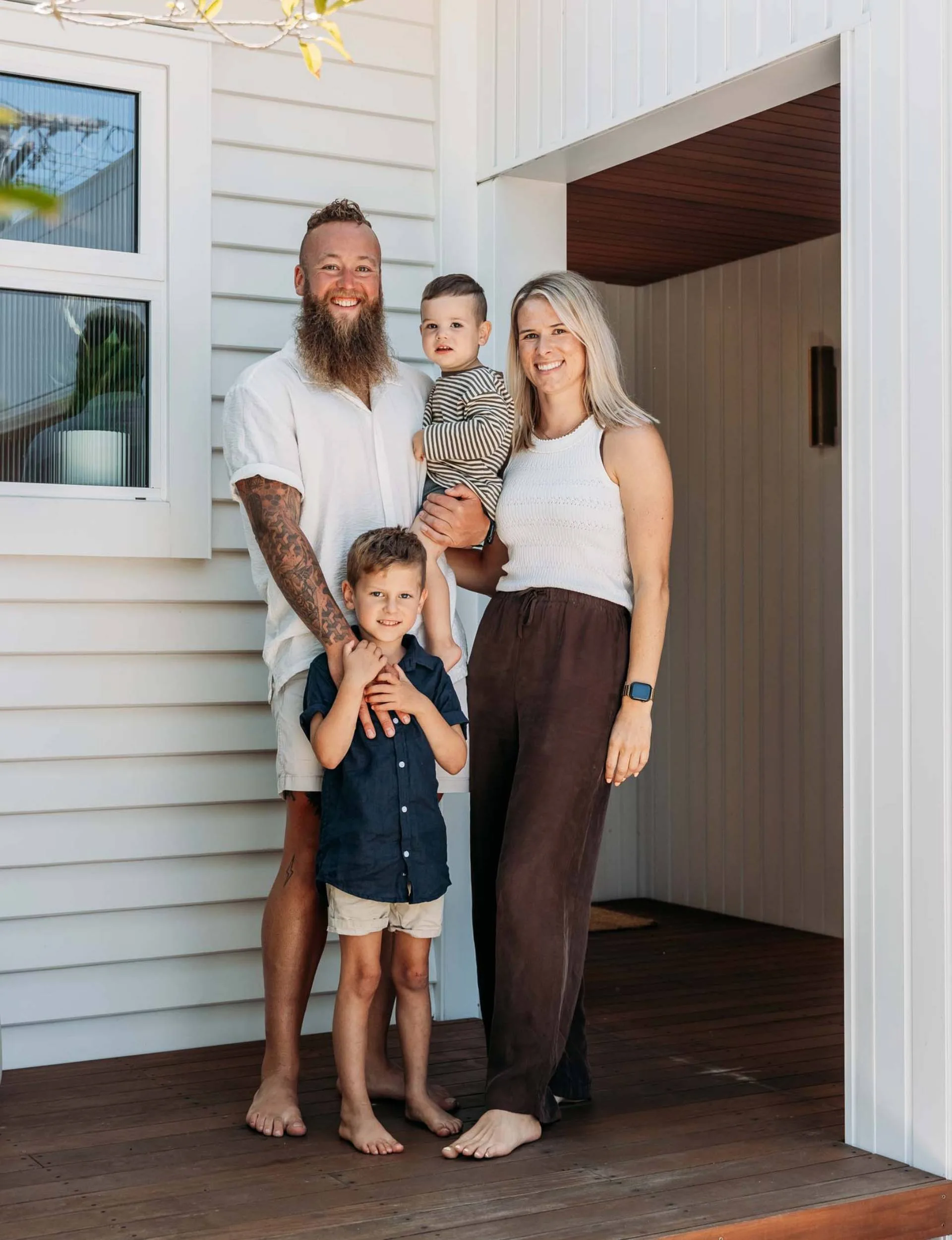 The renovated Wellington home owners on their front door step