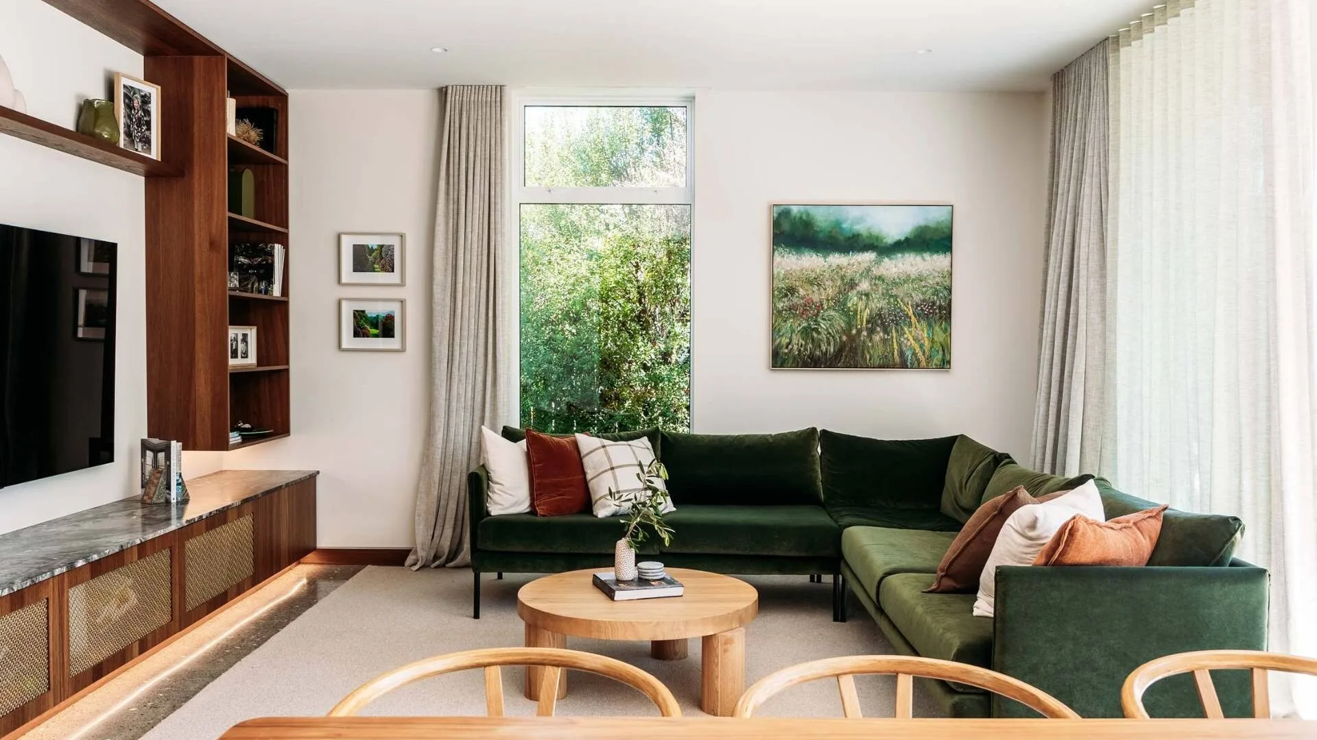 A green velvet couch in the Wellington home living room