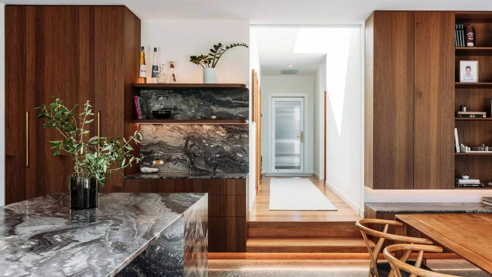 the renovated kitchen and hallway in the Wellington home