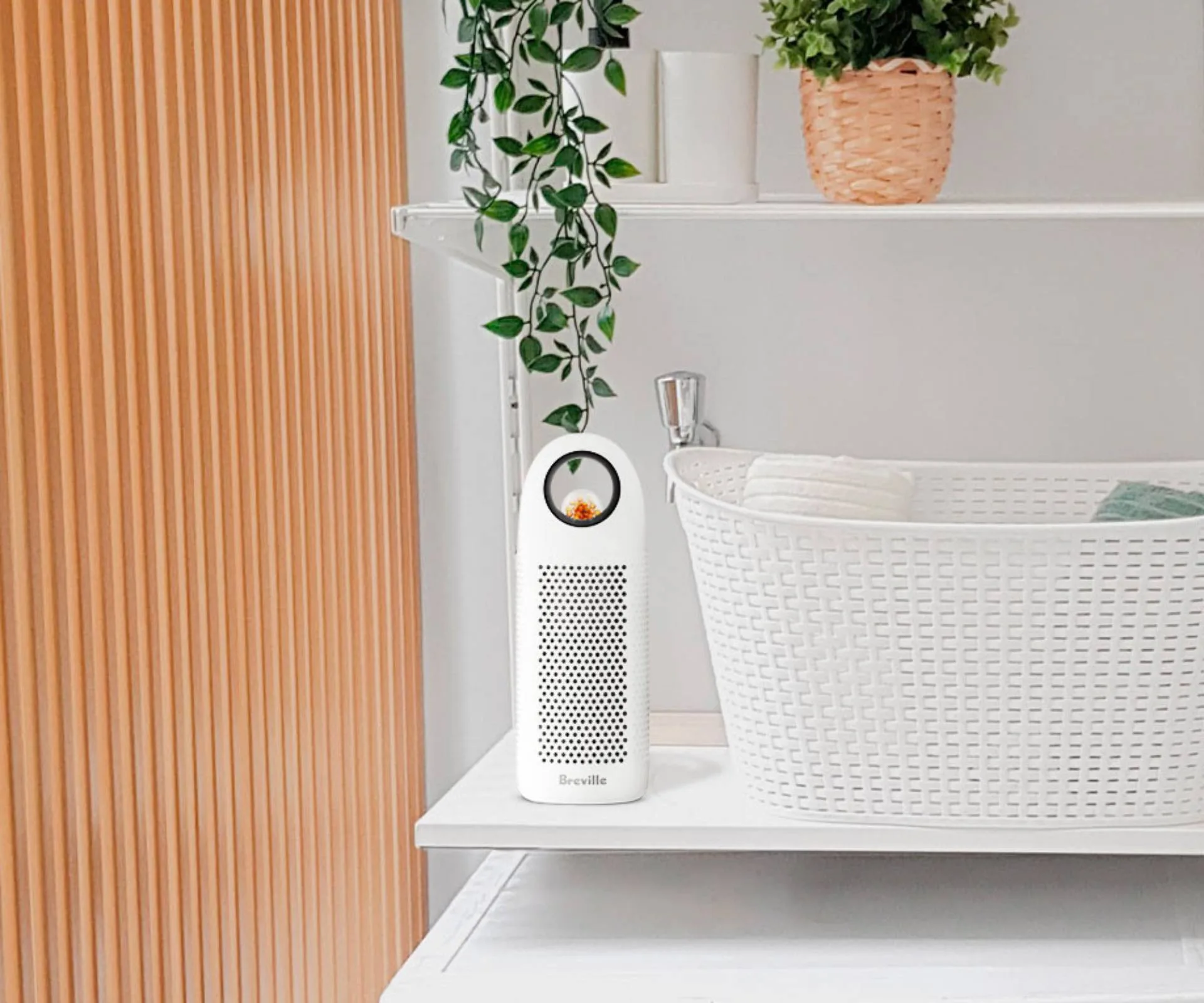 Breville mini dehumidifier on shelf in laundry room