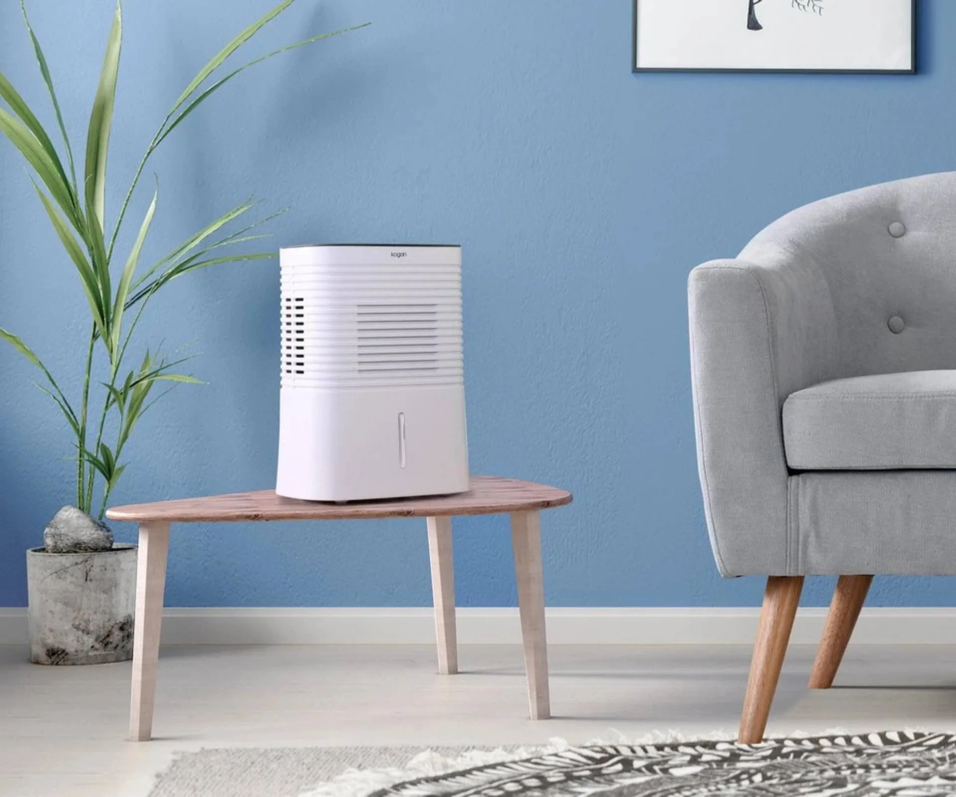 Small mini dehumidifier atop a side table in living room