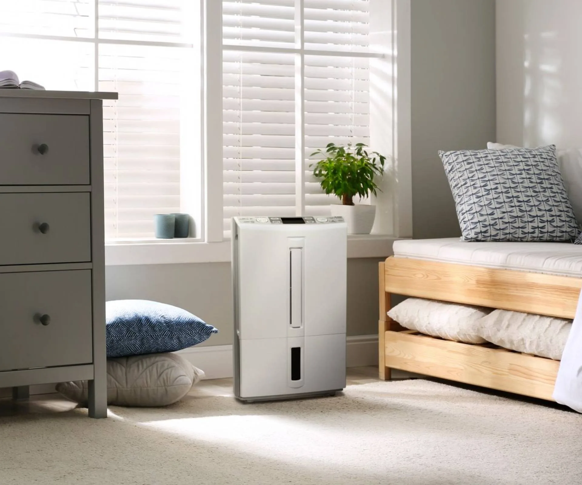 Mitsubishi dehumidifier in bedroom next to window