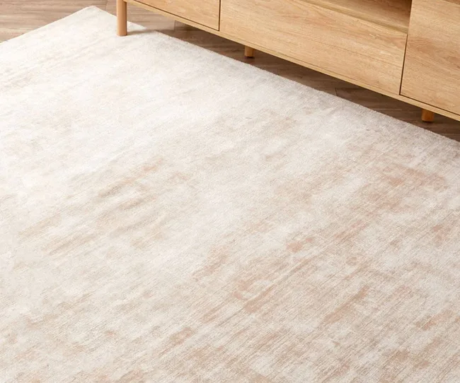 A peach coloured rug