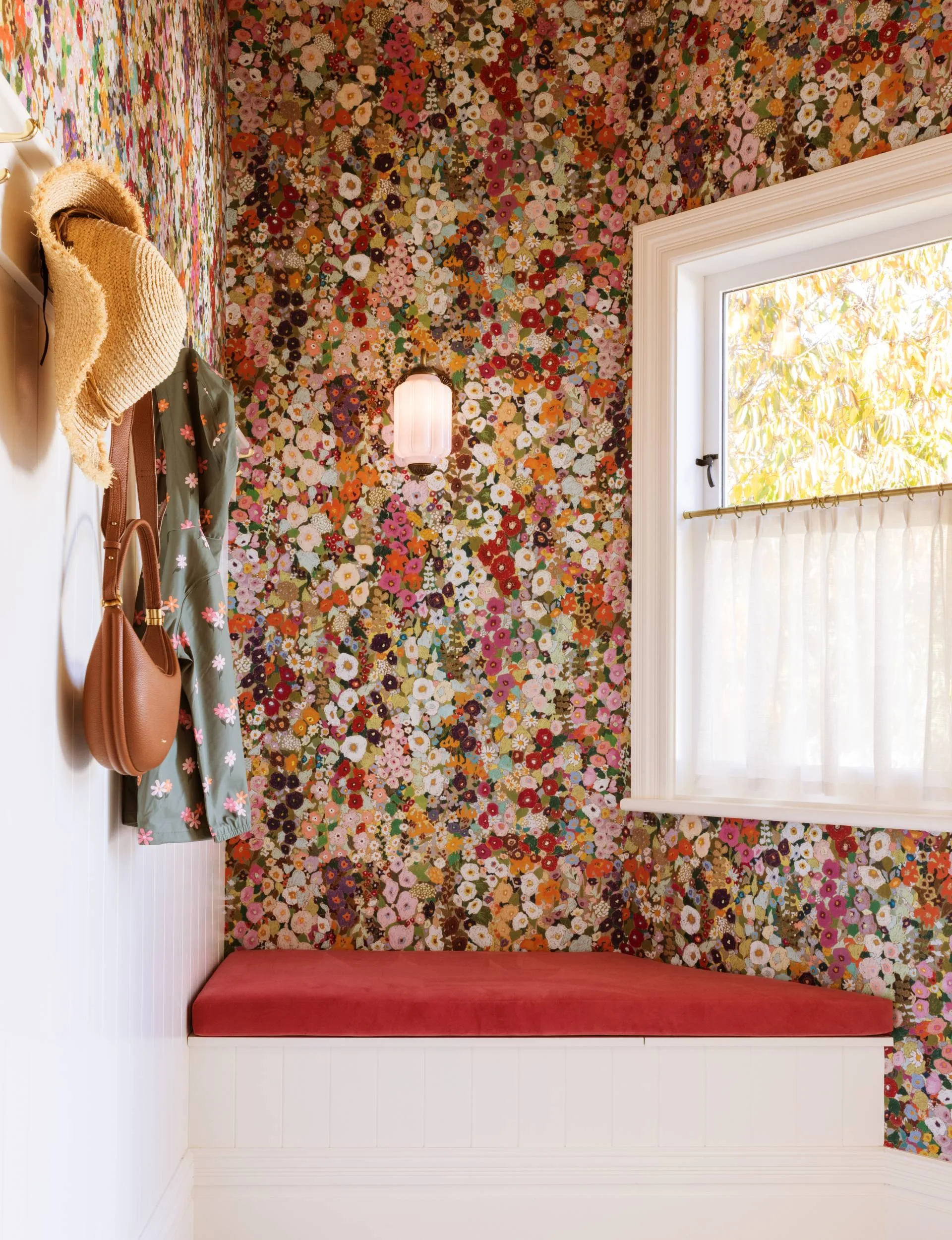 floral room with bags and jackets hanging