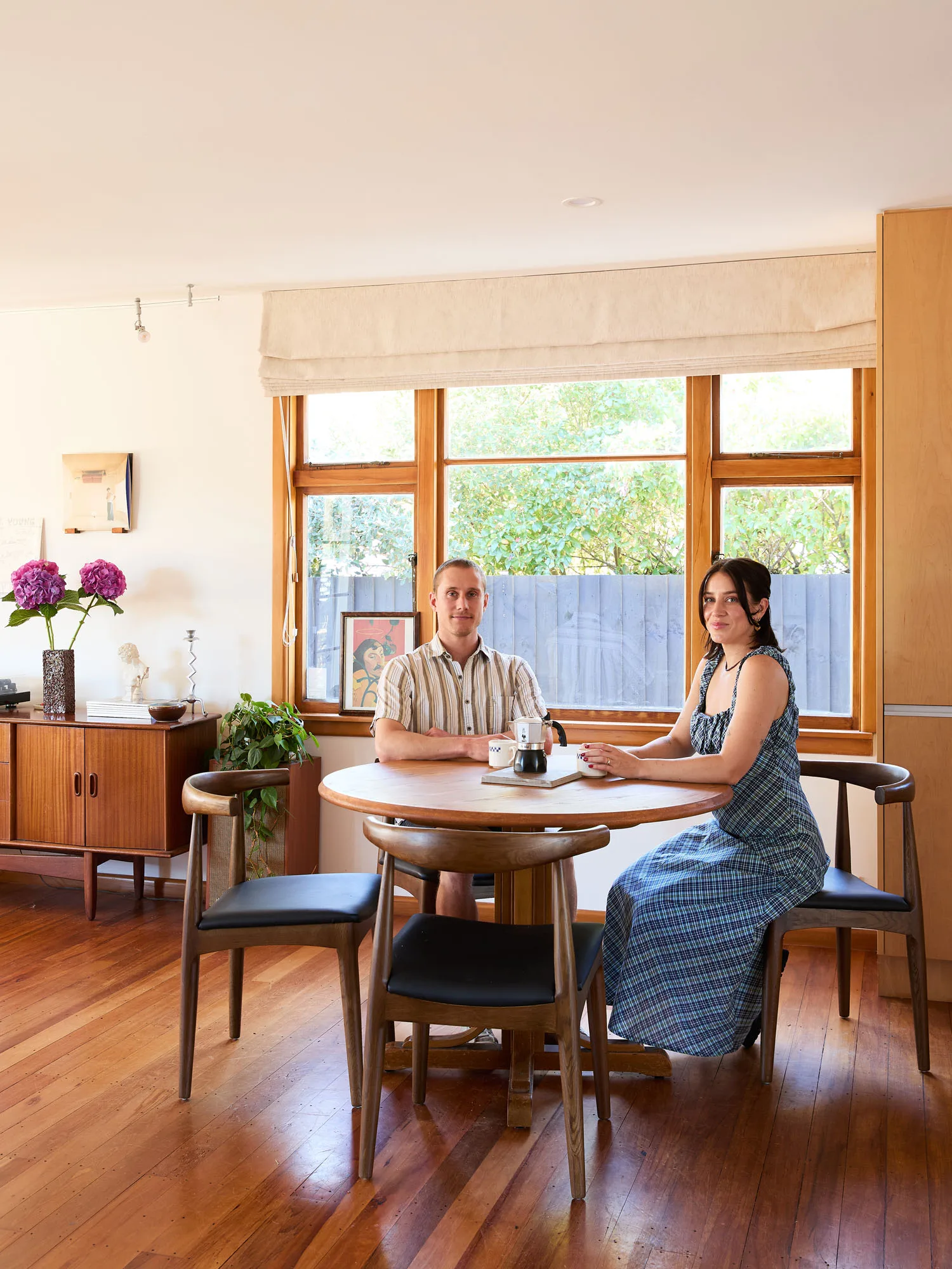 A young couple sitting at a dining table