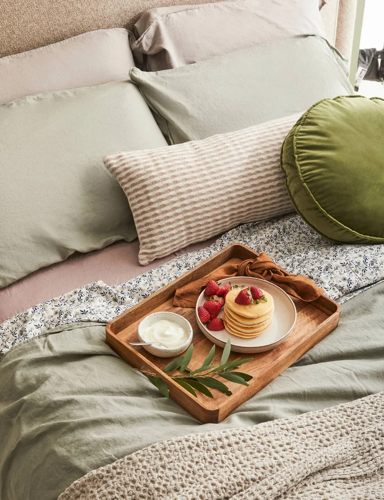 Pancakes on a plate, on a tray, on a bed