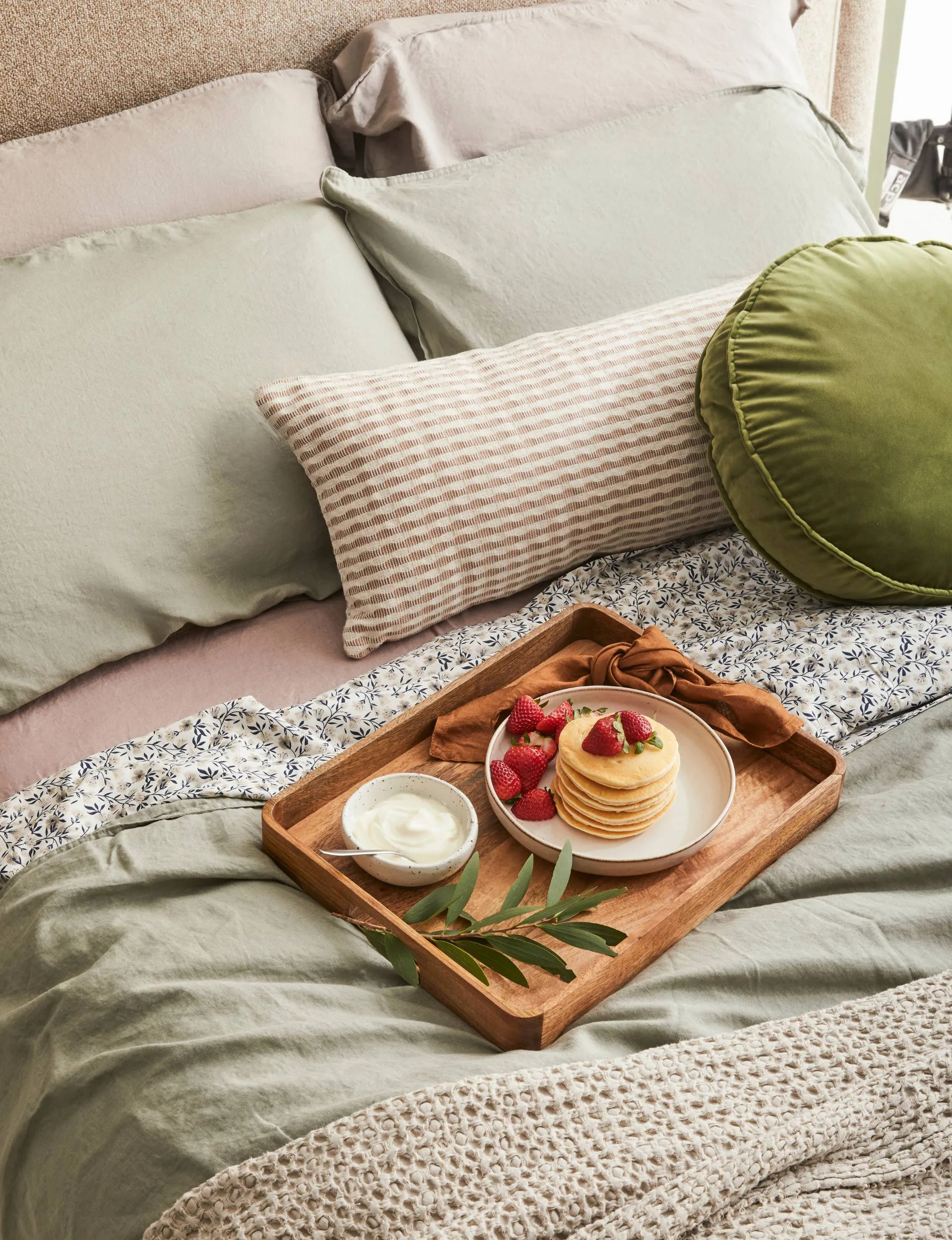 Pancakes on a plate, on a tray, on a bed