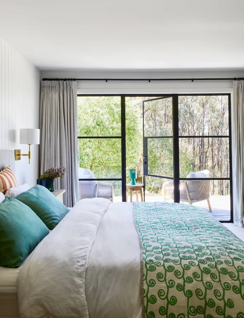 bedroom with green decor and glass door