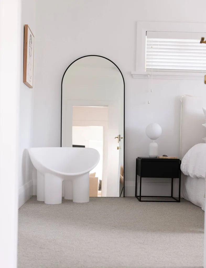 main room with mirror and chair