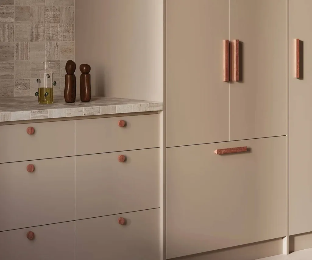 Kitchen cabinetry with stone handles
