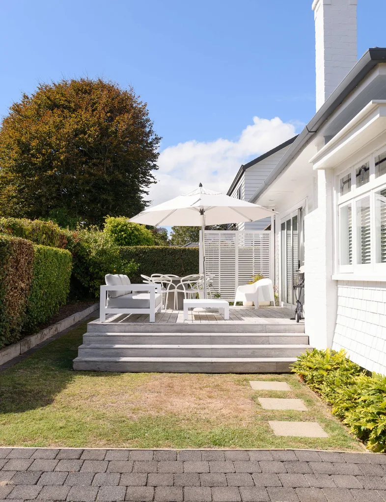 outside house, deck with white furniture