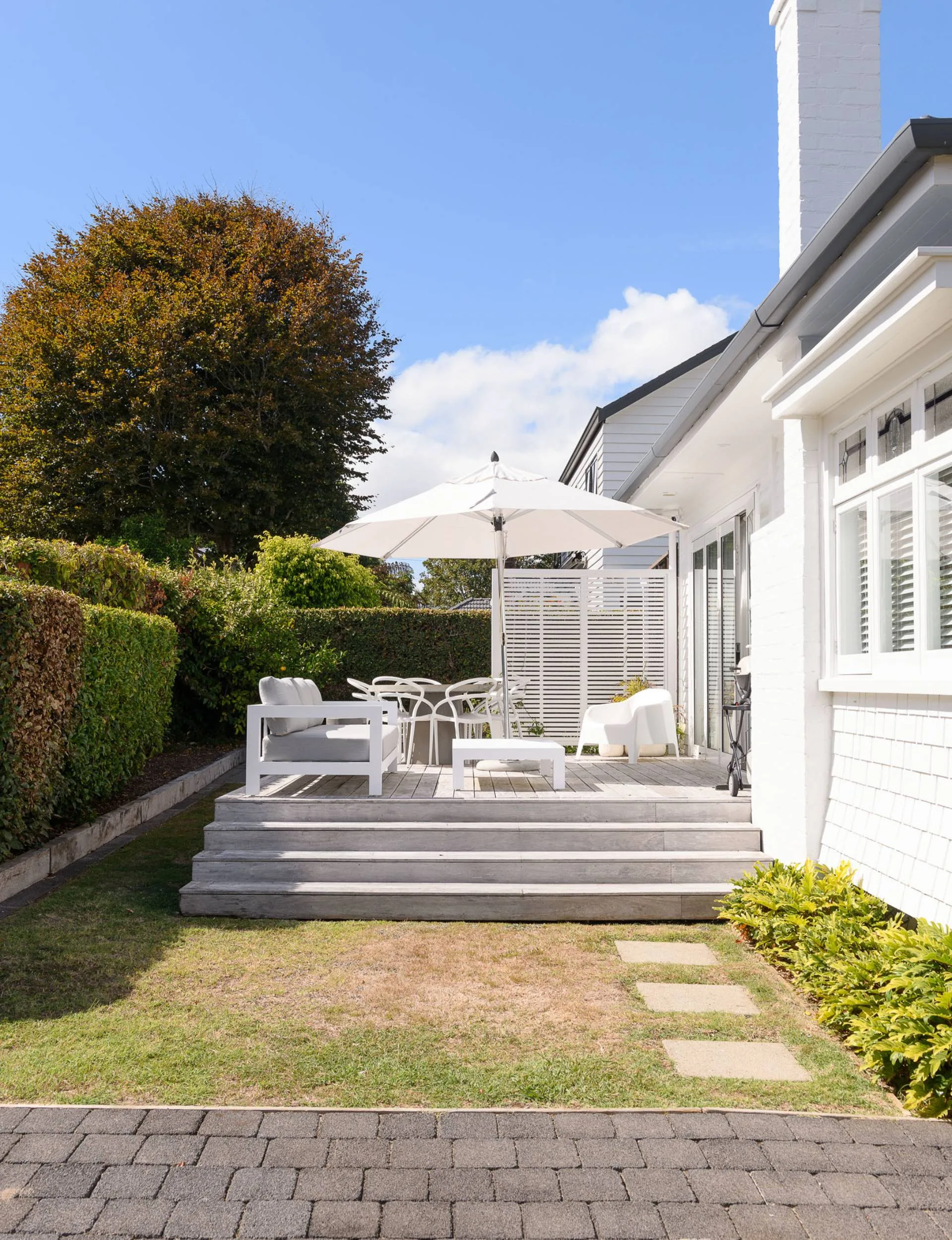 outside house, deck with white furniture