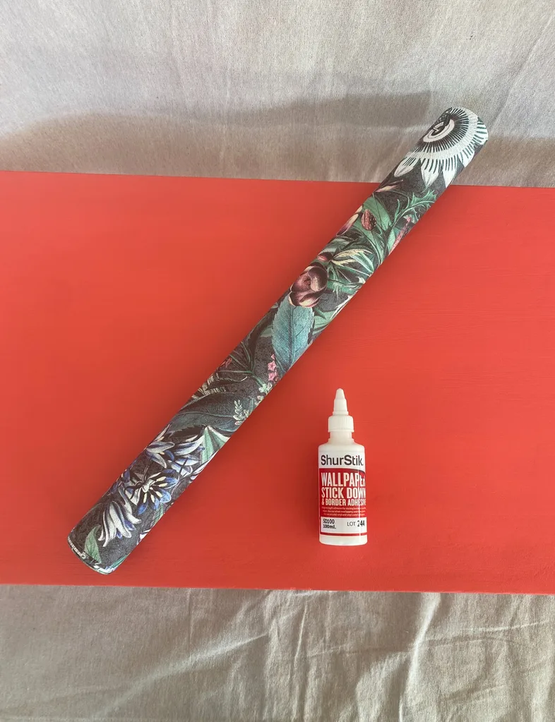 Last step, measure the wallpaper and glue to the upcycled coffee table top