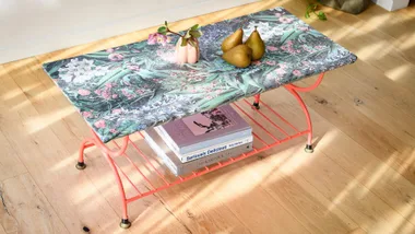 An upcycled coffee table given a refresh with wallpaper and paint