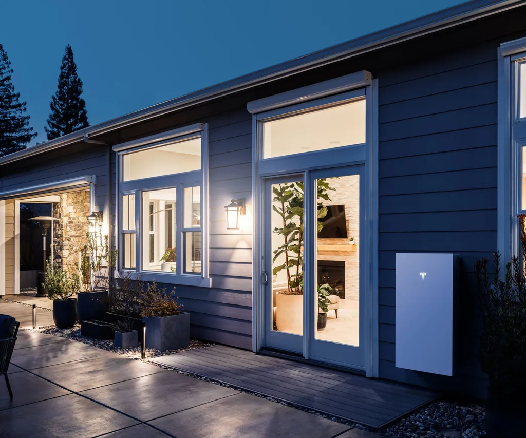 The Powerwall 3 against a suburban villa in the dark