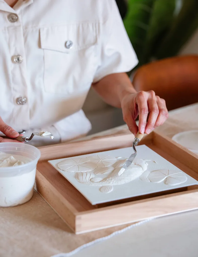 Erica Toh working on one of her relief works