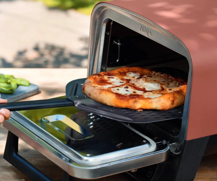 Ninja Woodfire cooking pizza for a crowd